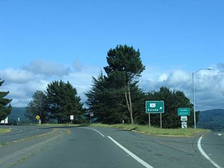 Northbound California 255 (Samoa Boulevard) approaches U.S. 101 (Redwood Highway) south to Eureka. The state route reduces to one lane eastbound; the next ramp connects to U.S. 101 north to Crescent City in Del Norte County (right exit/loop ramp).