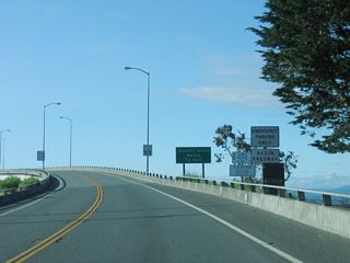 After leaving the U.S. 101 intersection, California 255 travels west on the first of three bridges to cross Humboldt Bay. The bridge lands on Woodley Island. The bridge is considered a freeway as noted by the Begin Freeway sign.