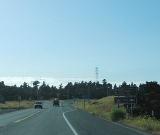 After leaving the Samoa Bridge, California 255 prepares to turn north. A left turn ahead connects to Samoa; a right turn leads toward Manila.