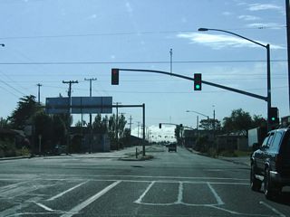 The first traffic signal on southbound (westbound) California 255 (Samoa Boulevard) (4th Street) after the U.S. 101 interchange is with G Street, which is the old alignment of U.S. 101. (G Street is not a business route although it could be if the southern end featured a complete interchange with U.S. 101.) The state route begins as a four-lane, divided highway in Arcata, but it will reduce to two lanes shortly. The city of Arcata is home to 16,651 people per the 2000 Census. Incorporated in 1858, Arcata is a college town, with Humboldt State University (a campus of the California State University system) located northeast of downtown Arcata. Other points of interest in the community include Arcata Marsh and Arcata's Community Forest (over 622 acres of timberland).