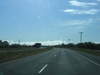 Continuing east, California 255 leaves Arcata, crosses a railroad, and passes through the wetlands that characterize the path to Samoa. For now the highway is a four-lane expressway, but it will soon downgrade to a conventional two-lane highway.