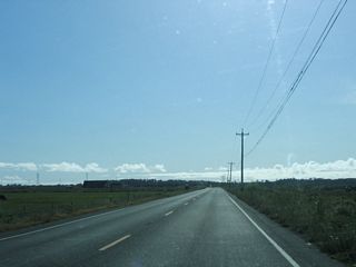 Prior to intersecting Jackson Ranch Road, this view of two-lane California 255 characterizes the highway for the remainder of its westbound route. The state route will soon turn south just before reaching the Pacific Ocean.