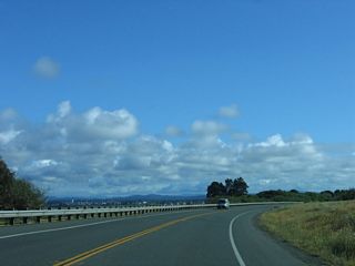 A couple of vantage points along the roadway offer views of the city of Eureka, the Samoa Bridge, and Humboldt Bay including this one found on southbound California 255.