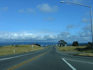 Upon turning, southbound California 255 immediately approaches the triple span bridge that carries the state highway from Samoa east to Eureka.