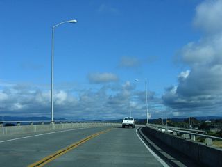 Southbound California 255 approaches downtown Eureka on the final span of the Samoa Bridge; the speed limit diminishes accordingly.