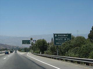 Highland Avenue was the pre-freeway alignment for SR 30. The business route was established upon completion of the freeway. SR 18 used to extend southwest from SR 210 in San Bernardino along then-SR 30 via SR 259, Interstate 215, and roughly via SR 91. During the time when SR 18 was a freeway along I-215 and CSR 259, its old alignment through San Bernardino was SR 18 Business.