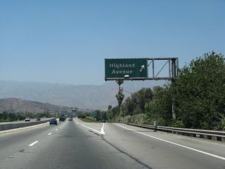 Exit 1 A departs from SR 259 north for Highland Avenue (old SR 18-30 Business).