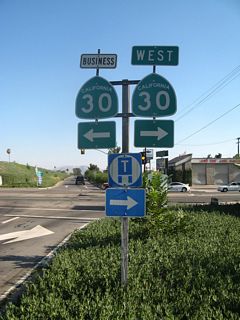 SR 30 and SR 30 Business shields formerly posted at the end of the ramp at Exit 1 B. SR 30 was replaced by SR 210.