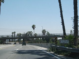 A route separation was indicated on this white bridge identification marker on southbound SR 259. This bridge was replaced during 2011-13 construction.