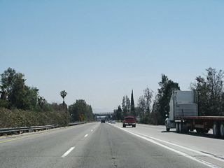 SR 259 used to merge with Interstate 215 south from the left. Interstate 215 travels south toward Riverside and San Diego.