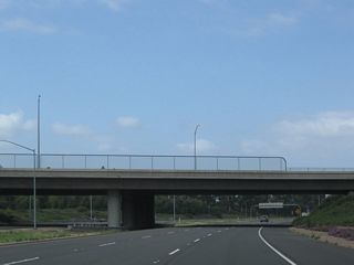 California 261 passes under Irvine Boulevard.