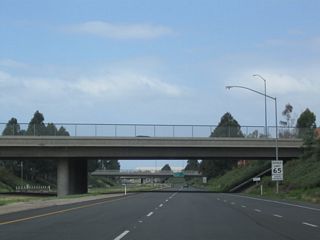 California 261 remains below grade as the freeway passes under Bryan Avenue (shown here) and El Camino Real (next overpass).