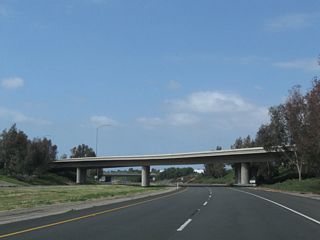 The transition ramp that carries Jamboree Road northbound traffic over California 261 comes into view ahead.