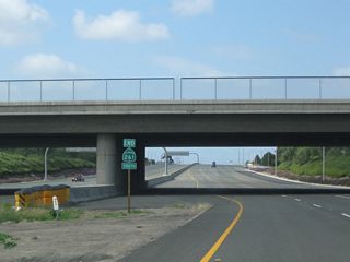 An end shield for SR 261 south appears in the median of the toll road at the Walnut Avenue over crossing.