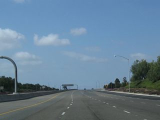 With the added traffic from Jamboree Road, the southbound freeway widens to five lanes as the continuation of Jamboree Road roughly between the southern limits of Tustin and northern limits of Irvine. Maintenance responsbilities for SR 261 are with the Transportation Corridor Agencies (TCA), while Jamboree Road is locally maintained by the cities of Irvine and Tustin.
