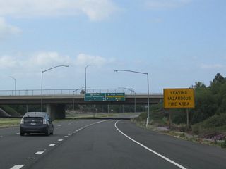 Motorists on California 241 south entered a hazardous fire area near the Windy Ridge Toll Plaza; upon passing into the Irvine Ranch Toll Plaza, travelers on California 261 south leave the hazardous fire area.