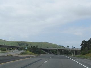 California 261 is the Eastern Transportation Corridor spur that leads south from California 241 into southern Tustin and northern Irvine. This view looks south along California 261 immediately after the split from California 241 near Irvine Lake (Santiago Reservoir).