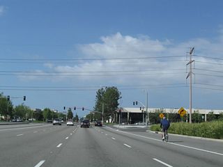 A 230kV Southern California Edison power line crosses over the Jamboree Road at Barranca Parkway.