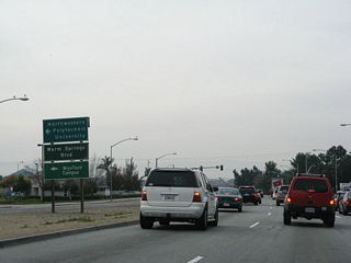 The next signalized intersection along California 262 (Mission Boulevard) east is with Warm Springs Boulevard. On the northeast corner of this intersection is Warm Springs Plaza. Use Warm Springs Boulevard north to Osgood Road and Grimmer Boulevard.  To the south, Warm Springs Boulevard connects to Warren Avenue and Scott Creek Road before entering the city of Milpitas in Santa Clara County and changing into Milpitas Boulevard.