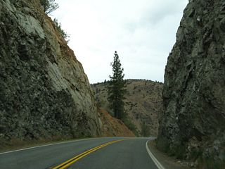 California 263 passes through a tight rock cut north of the Dry Gulch Bridge.