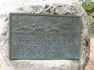 A plaque commemorates the naming of the Pioneer Bridge, which was named in honor of pioneer stage drivers. The plaque was placed here (north end of bridge on east side of road) on August 29, 1931.