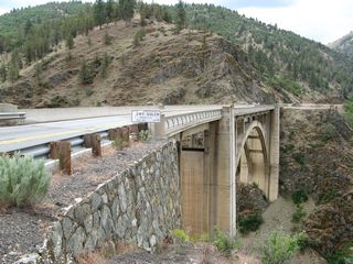 This is a side view of the 1929 Dry Gulch Bridge looking south. The bridge railing has been replaced since its original installation.