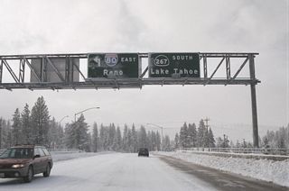 This signage was in place prior to the construction of the Carlson Bypass. SR 267 traveled south from I-80 into Downtown Truckee, then turned south via Brockway Road. Although not shown on these signs, this was previously the beginning of westbound Business Loop I-80, which was decommissioned with the completion of the Carlson Bypass. The business route lined Old U.S. 40 in Truckee west toward Donner Lake. A bypass of SR 267, which connects with the north shore of Lake Tahoe, alleviated some traffic issues in this area.