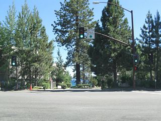 Motorists are afforded a brief glimpse of the famously blue waters of Lake Tahoe before turning east or west on California 28 (North Tahoe Boulevard).