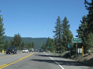 Southbound California 267 (North Shore Road) leaves Nevada County and enters Placer.