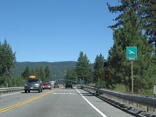 The next traffic signal along California 267 south (east) is with Truckee Tahoe Airport Road and Schaffer Mill Road. Turn left to Truckee-Tahoe Airport.