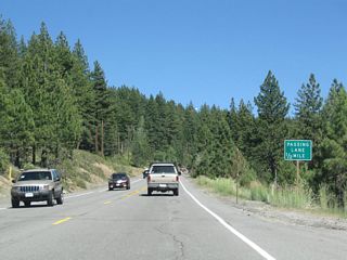 A passing lane is ahead (one-half mile).