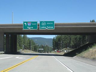 California 267 begins after traffic bound for Interstate 80 west and California 89 south merge onto the freeway. An overhead sign advises of the upcoming left turn to Interstate 80 east and the beginning of California 267 south to the north shore of Lake Tahoe.