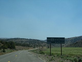 No longer posted, this distance sign stood near mile post 4.00 at Mormom Meadow.