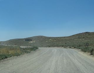 Leaving Bodie State Historic Park along the unpaved stretch of Bodie Road. This section of highway covers about three miles, then upgrades to Caltrans maintenance.