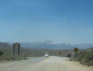A series of signs warns of the winding, narrow road for the next ten miles and downgrade from here to U.S. 395.
