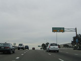 Spanning California 163, an auxiliary lane extends from Mercury Street to the entrance ramp for the Cabrillo Freeway north.
