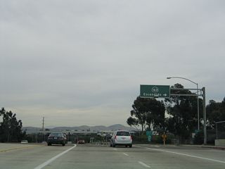 The left lane of Balboa Avenue eastbound becomes a turn lane to Kearny Villa Road northeast beyond the loop ramp for California 163 (Cabrillo Freeway) north.