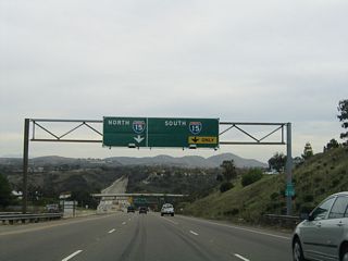 Balboa Avenue meets Interstate 15 (Escondido Freeway) at a cloverstack interchange in Murphy Canyon.