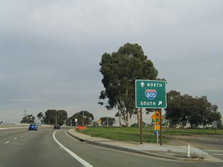 Balboa Avenue enters a cloverleaf interchange with Interstate 805 (Dekema Freeway) east of Charger Boulevard. I-805 travels south to Mission Valley, North Park, National City, Chula Vista, and the International Border at San Ysidro.