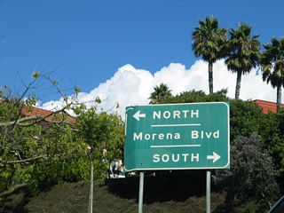 Button copy sign posted along the ramp from westbound Balboa Avenue to Morena Boulevard. The arterial heads north to Bay Ho and south to Bay Park and the Morena district.