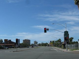 Westbound Balboa Avenue at Mt. Alifan Drive and Mt. Abernathy Avenue, where a remnant "WEST" banner from a removed SR 274 shield remained.