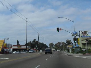 Westbound Garnet Avenue proceeds into Pacific Beach from Mission Bay Drive (Historic U.S. 101) ahead of the signal with Bond Street.