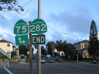 An end California 282 shield assembly used to be posted at its junction with California 75 (Orange Avenue) on the left side of the roadway. The shields have since been removed (gone by 2008). California 75 north continues straight ahead on Fourth Street onto the San Diego-Coronado Bay Bridge, while southbound California 75 turns south through downtown Coronado onto the Silver Strand.
