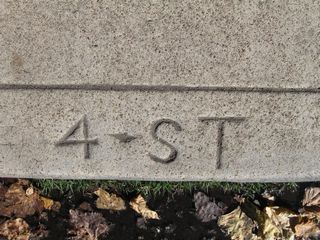 A date stamp etched into the concrete curb along California 282 (Fourth Street) shows the street name.