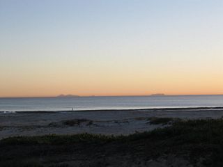 Located in Mexico, the Coronado Islands are visible on clear days from the Coronado beach (and from Point Loma). On this clear day, Santa Ana winds blew warm air from the east, thus pushing moist air away from the coast and bringing clear, dry air from the desert.