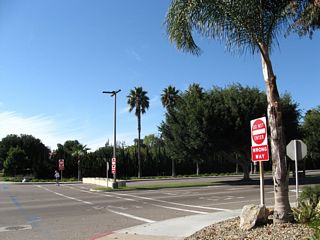 The former entrance to the base is now the exit from the base and flanked by DO NOT ENTER signs. The lanes that used to guide motorists onto the base have been reversed; the former exit lanes are not in use currently. Several barricades block passage to the former exit lanes.