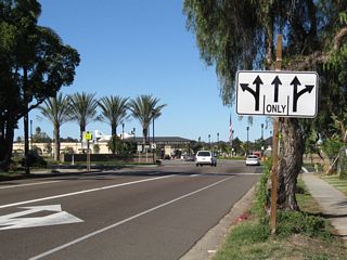 All three lanes will enter the U.S. Navy base. Only the left and right lanes offer turns onto Alameda Boulevard. Use the left lane to turn onto California 282 (Alameda Boulevard) south.