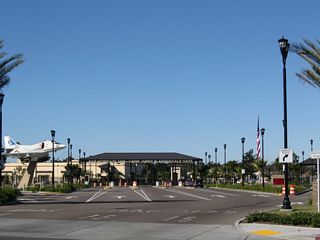 The entrance to the North Island Naval Air Station is located beyond the Alameda Boulevard intersection. Note the left ramp to the visitors center. California 282 turns south for one block on Alameda Boulevard to the location of the former base entrance from Fourth Street.