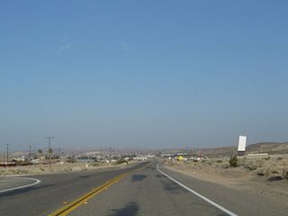 A drive-in movie theater is located on the north side of Old Highway 58 by Hawthorne Drive.