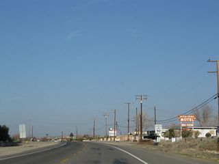 The two-lane highway continues west toward Barstow on a route that roughly parallels the Mojave River while staying on the north side of the river.